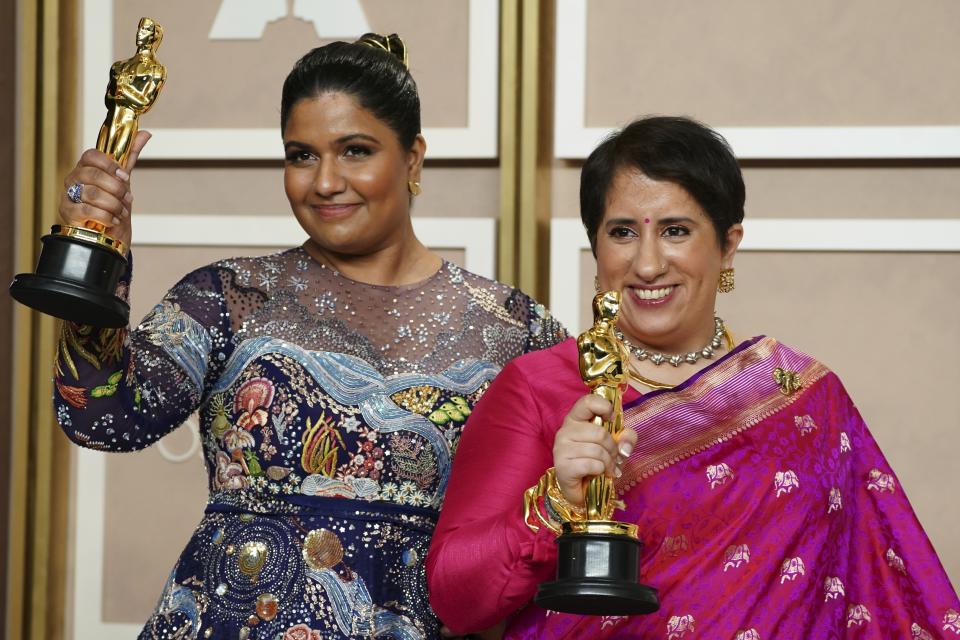 Kartiki Gonsalves, left, and Guneet Monga pose with the award for best documentary short film for "The Elephant Whisperer" in the press room at the Oscars on Sunday, March 12, 2023, at the Dolby Theatre in Los Angeles. (Photo by Jordan Strauss/Invision/AP)