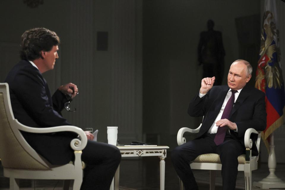 FILE - In this photo released by Sputnik news agency on Friday, Feb. 9, 2024, Russian President Vladimir Putin, right, speaks during an interview with former Fox News host Tucker Carlson at the Kremlin in Moscow, Russia, Tuesday, Feb. 6, 2024. When former Fox News host Tucker Carlson last week asked Vladimir Putin about his reasons for sending troops into Ukraine two years ago, Putin gave him a lecture on Russian history, arguing that Ukrainians and Russians historically have always been one people, and that Ukraine's sovereignty is merely an illegitimate holdover from the Soviet era. In Russia, history has long become a propaganda tool used to advance the Kremlin's political goals. (Gavriil Grigorov, Sputnik, Kremlin, Pool Photo via AP, File)