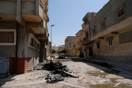 A view of destroyed buildings and cars after forces loyal to Libyan commander Khalifa Haftar took control of the area, in Derna, Libya June 13, 2018. Picture taken June 13, 2018. REUTERS/Esam Omran Al-Fetori