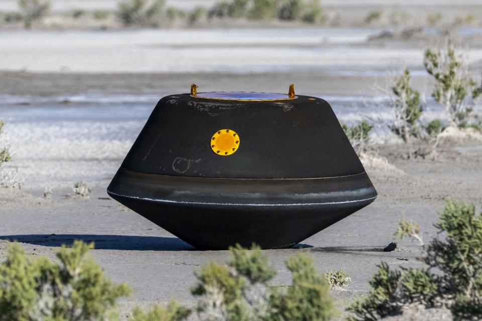 In this photo provided by NASA, the sample return capsule from NASA’s Osiris-Rex mission lies on the ground shortly after touching down in the desert, at the Department of Defense’s Utah Test and Training Range on Sunday, Sept. 24, 2023. The sample was collected from the asteroid Bennu in October 2020. | Keegan Barber, NASA via Associated Press