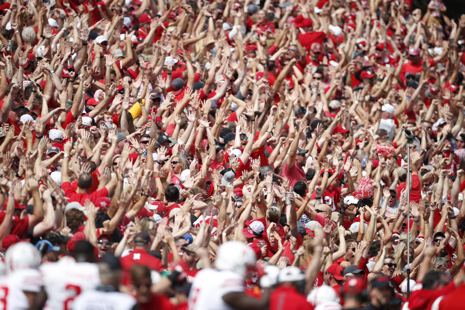 FILE - Nebraska fans cheer in the first half of an NCAA college football game against Colorado,Saturday, Sept. 7, 2019, in Boulder, Colo. The current football players at Nebraska and Colorado weren't alive when the rivalry between the schools was in its heyday. (AP Photo/David Zalubowski, File)