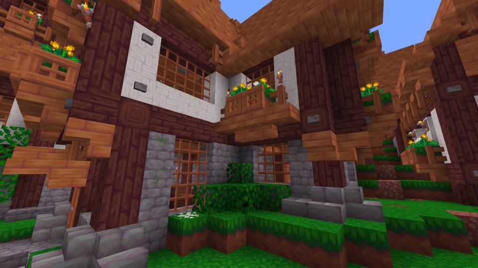 Minecraft texture packs - Woodpecker - a view of a small village with cartoonish, bright colored blocks.