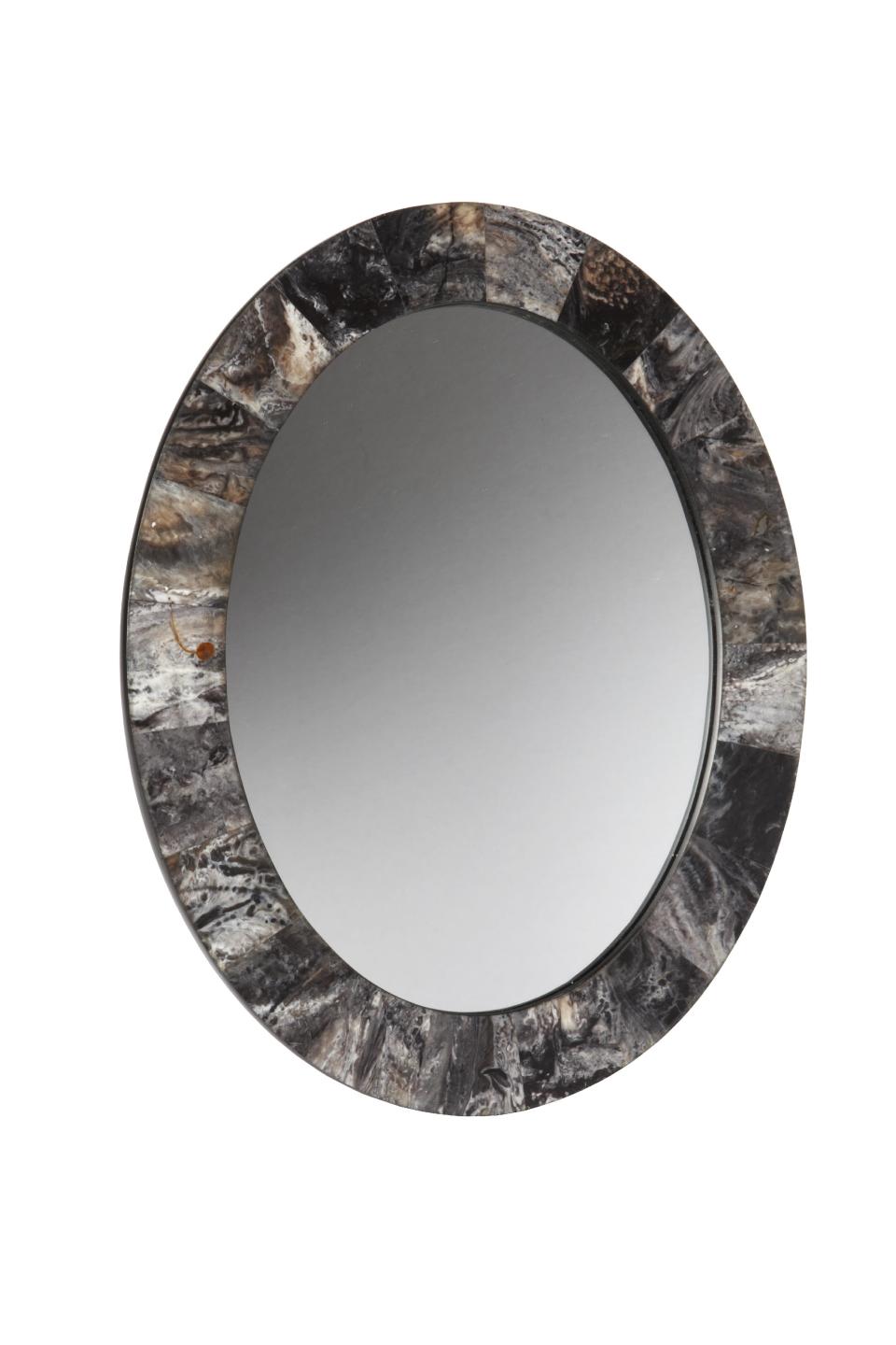 This undated photo provided by Target shows a mirror with a marble border that give it a textural, contemporary edge from Target’s new fall Threshold collection. (AP Photo/Target)