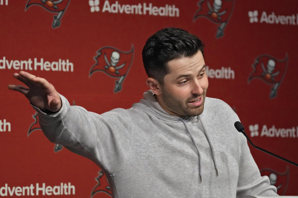 New Tampa Bay Buccaneers quarterback Baker Mayfield gestures during an NFL football news conference on Monday, March 20, 2023, in Tampa, Fla. The Buccaneers signed Mayfield to a one year contract. (AP Photo/Chris O'Meara)