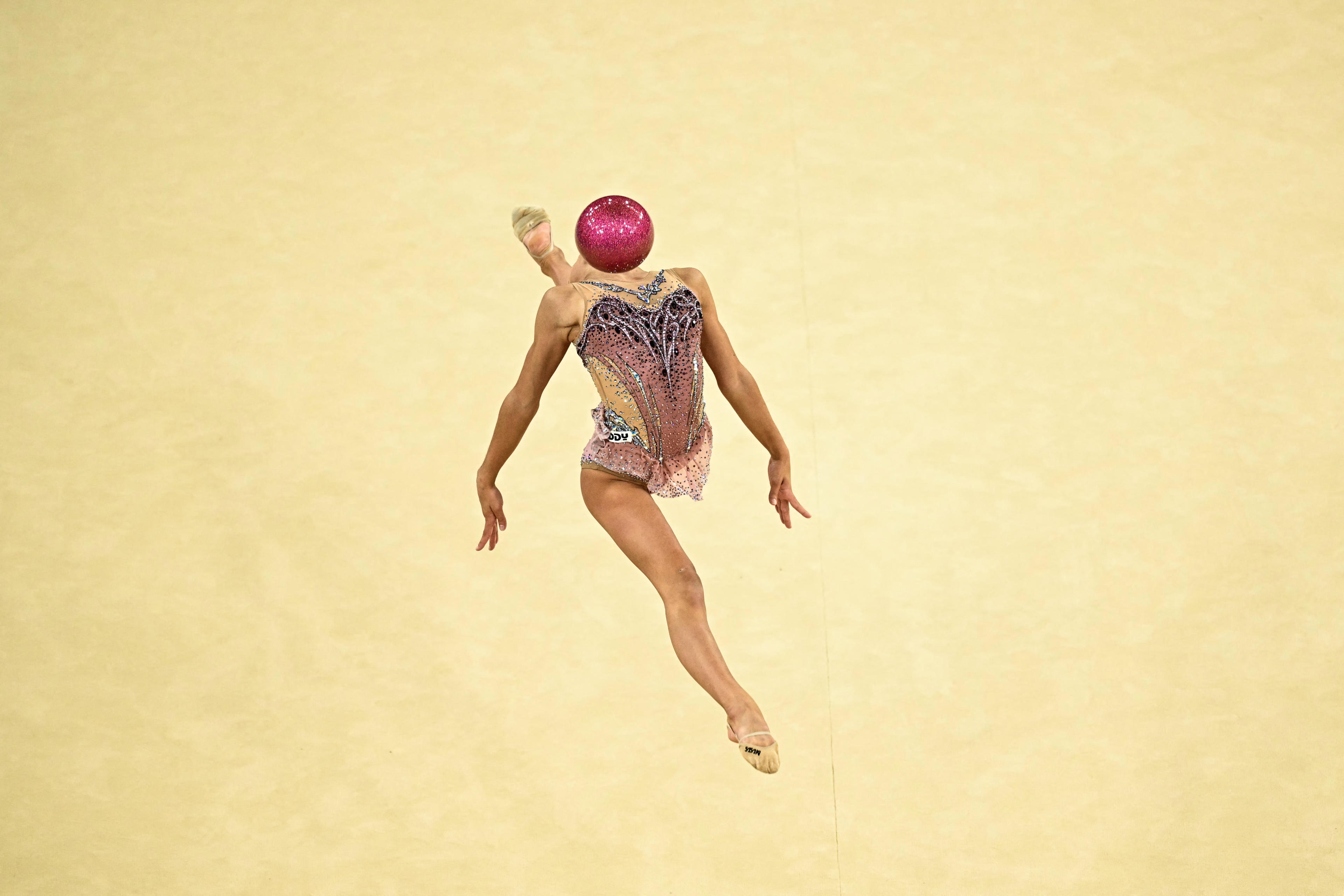 Italy's Sofia Raffaeli performs with the ball in the rhytmic gymnastics' individual all-around qualification during the Paris 2024 Olympic Games at the Porte de la Chapelle Arena in Paris, on August 8, 2024. (Gabriel Bouys/AFP/Getty Images) 