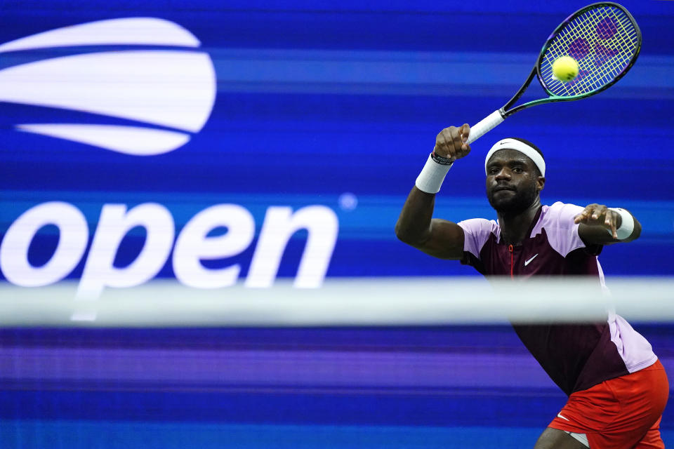 Frances Tiafoe, of the United States, returns a shot to Carlos Alcaraz, of Spain, during the semifinals of the U.S. Open tennis championships, Friday, Sept. 9, 2022, in New York. (AP Photo/Matt Rourke)