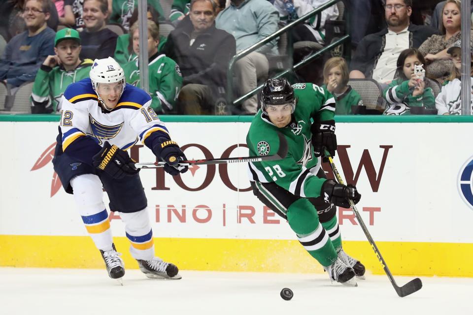 DALLAS, TX - MARCH 12:  Stephen Johns #28 of the Dallas Stars controls the puck against Jori Lehtera #12 of the St. Louis Blues in the second period at American Airlines Center on March 12, 2016 in Dallas, Texas.  (Photo by Tom Pennington/Getty Images)
