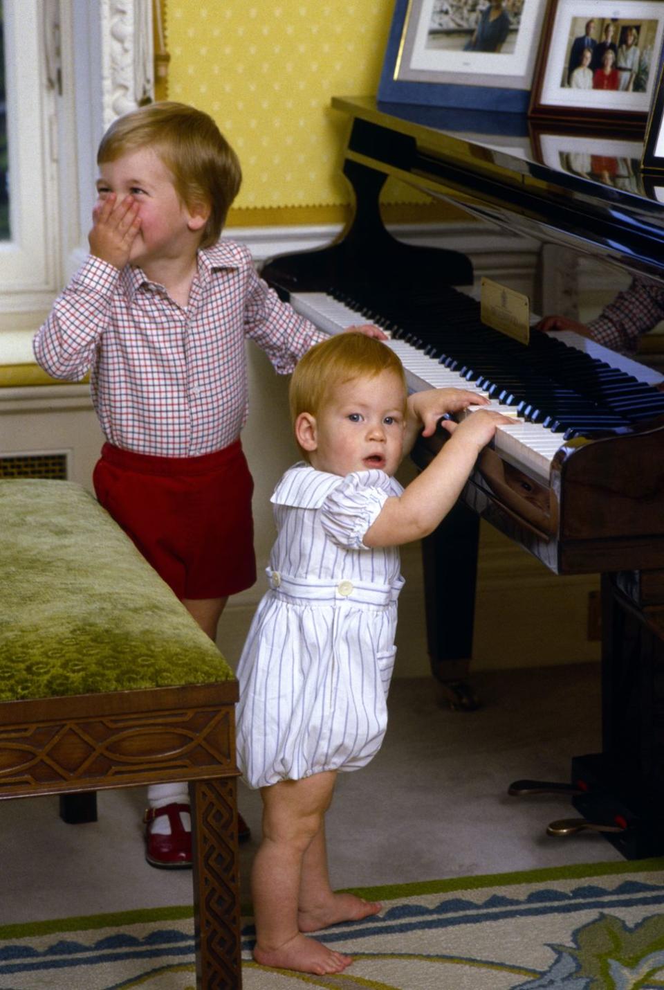 <p>Prince William giggles while his brother Prince Harry fiddles with some keys on the piano at their home in Kensington Palace. The princes, who have lived in separate apartments within the palace over the years, have maintained a close relationship. Shortly after Harry announced his engagement in November 2017, <a href="https://twitter.com/KensingtonRoyal/status/935908818118217728" rel="nofollow noopener" target="_blank" data-ylk="slk:William told reporters;elm:context_link;itc:0;sec:content-canvas" class="link ">William told reporters</a>, “For me personally, I hope it means he stays out of my fridge and stop him scrounging over my food like he’s done over the last few years. I’m pretty excited."</p>