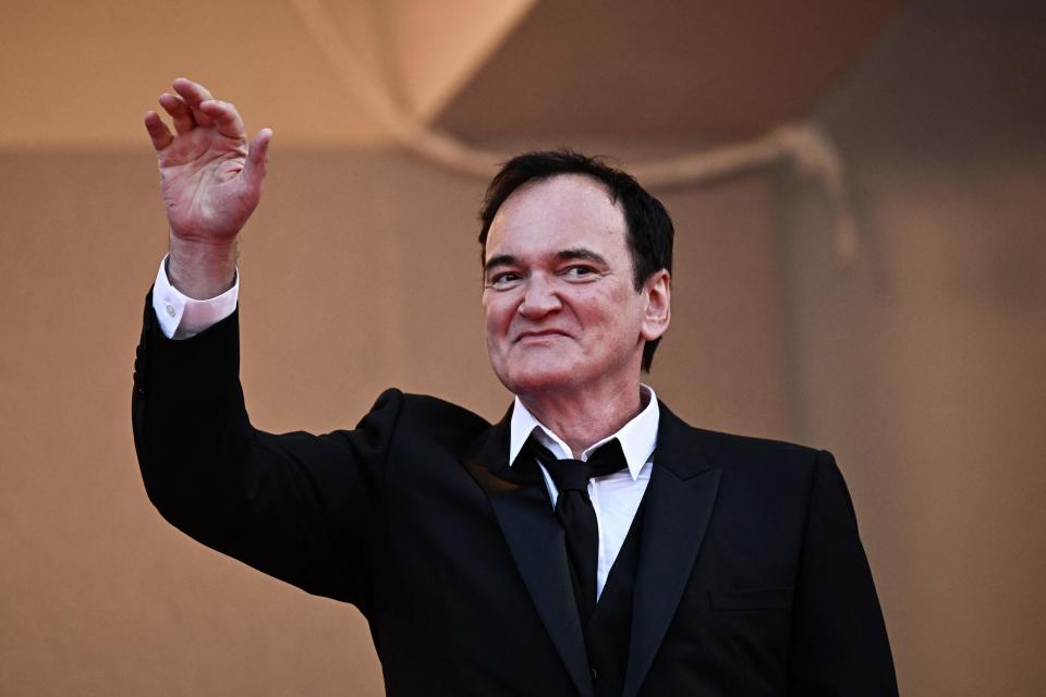 US director Quentin Tarantino waves as he arrives for the Closing Ceremony and the screening of the film 
