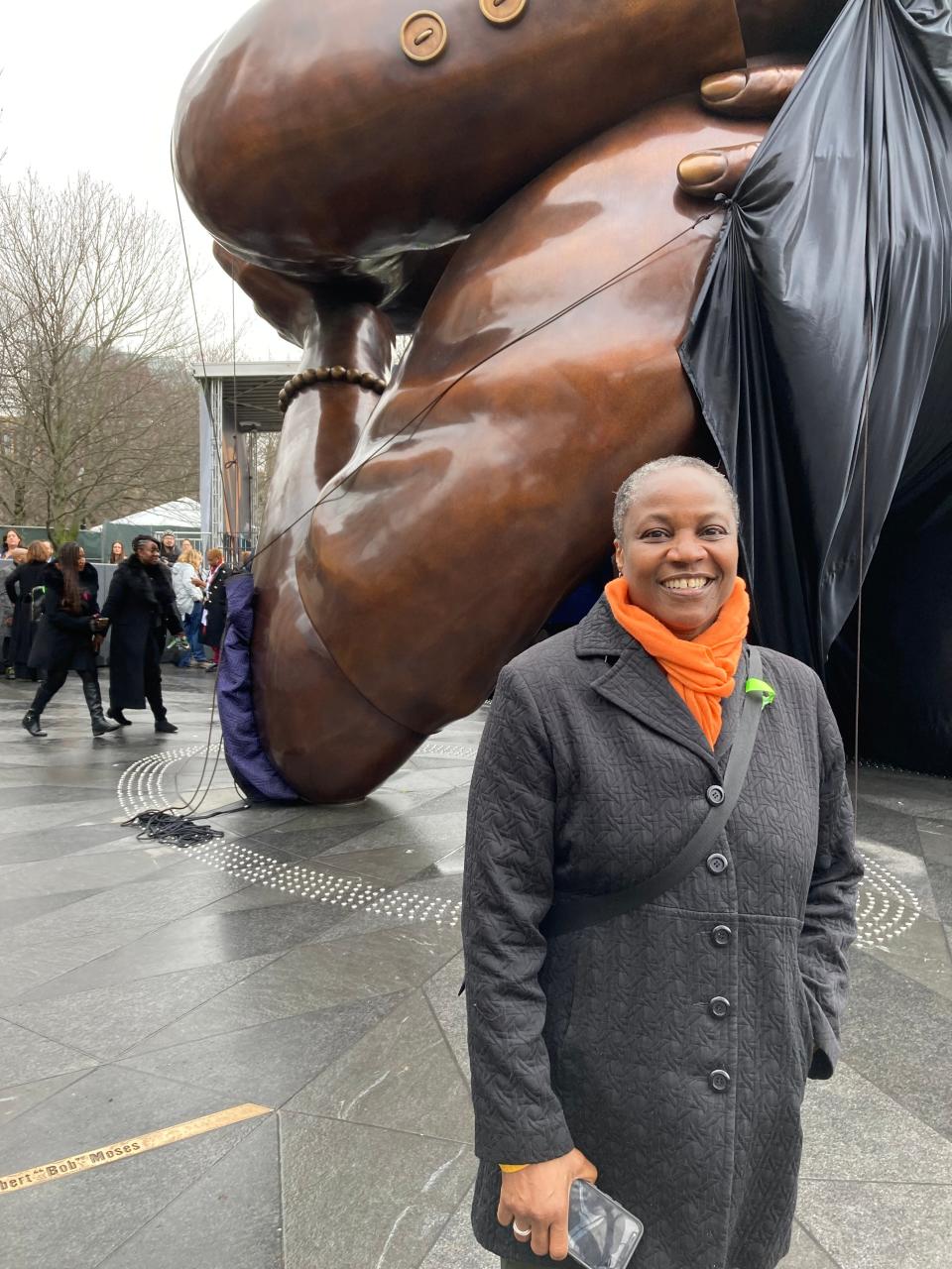 Nadine Jones found her father's name in bronze on the 1965 Freedom Plaza trail that surrounds "The Embrace," which was unveiled Friday in Boston, honoring Rev. Martin Luther King Jr., and the civil rights movement.