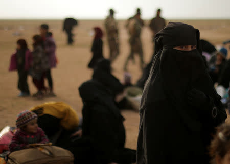 A girl looks on, near the village of Baghouz, Deir Al Zor province, Syria February 26, 2019. REUTERS/Rodi Said