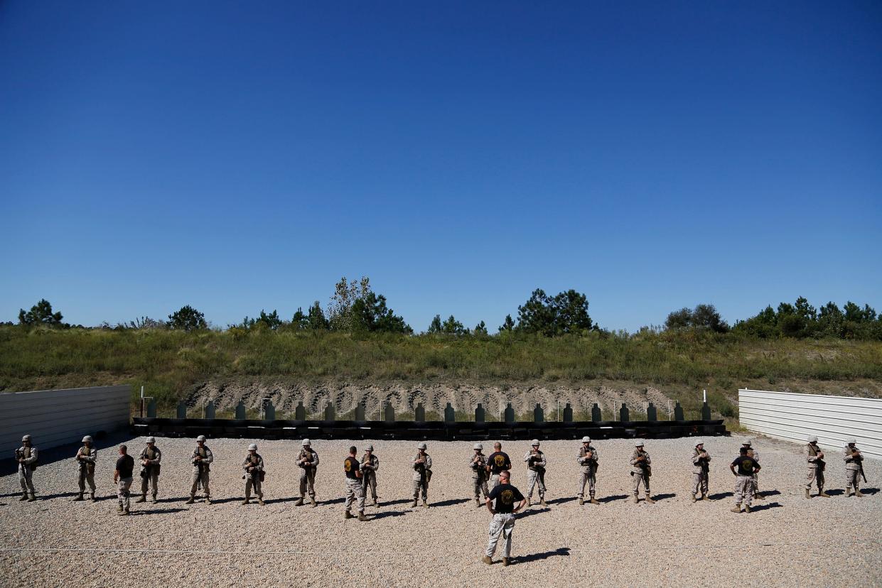 U.S. Marines train on a firing range to be members of an antiterrorism security team at a training ground in Chesapeake, Virginia, Sept. 25, 2012. The Corps has issued new rules requiring reporting of extremist activity.