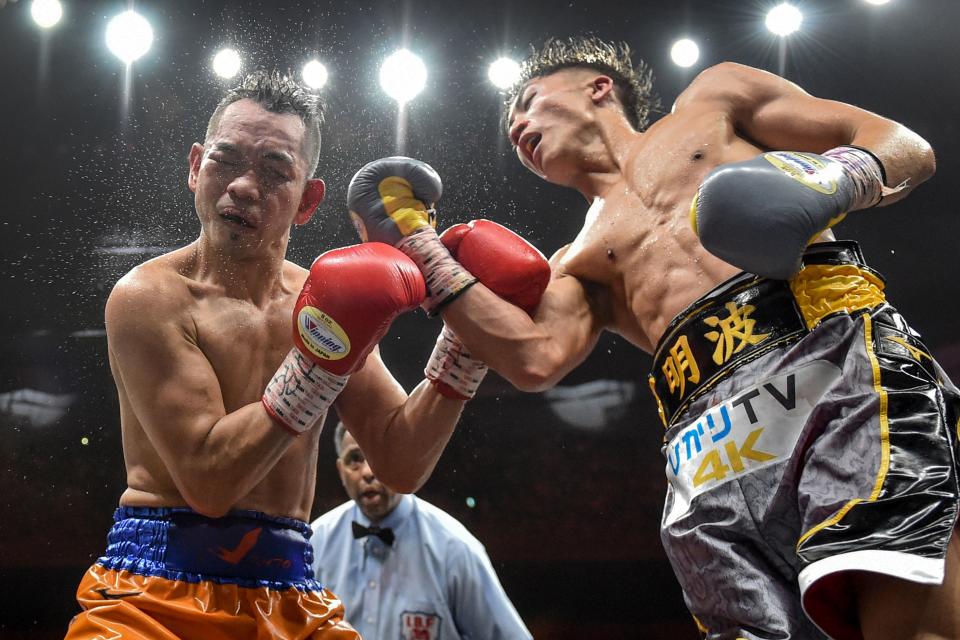 Naoya Inoue of Japan (R) and Nonito Donaire of Philippines (L) fight in their World Boxing Super Series bantamweight final at Saitama Super Arena in Saitama on November 7, 2019. (Photo by Kazuhiro NOGI / AFP) (Photo by KAZUHIRO NOGI/AFP via Getty Images)