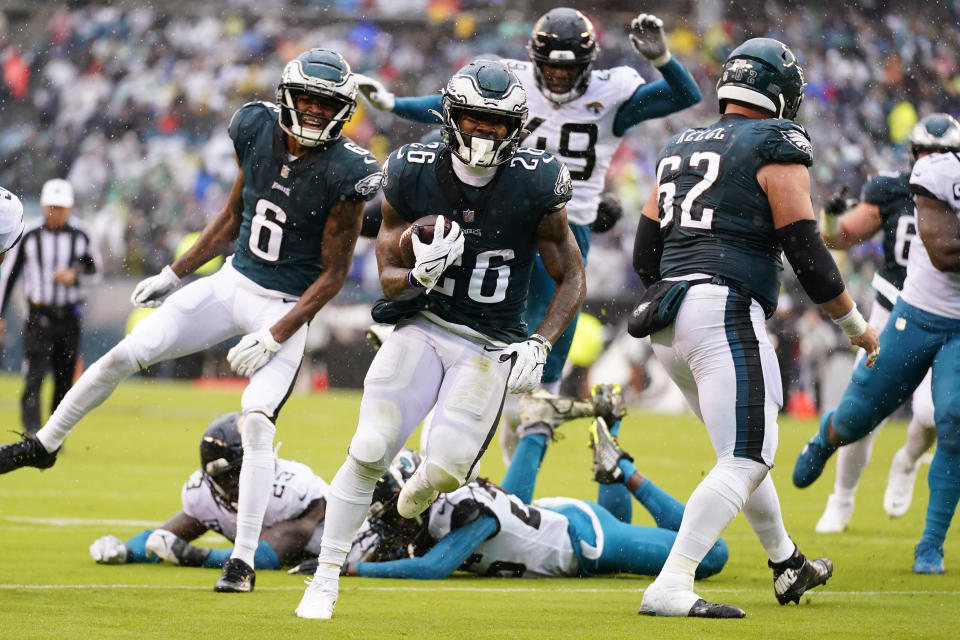 Philadelphia Eagles' Miles Sanders, center, runs in for a touchdown during the first half of an NFL football game against the Jacksonville Jaguars on Sunday, Oct. 2, 2022, in Philadelphia. (AP Photo/Matt Rourke)