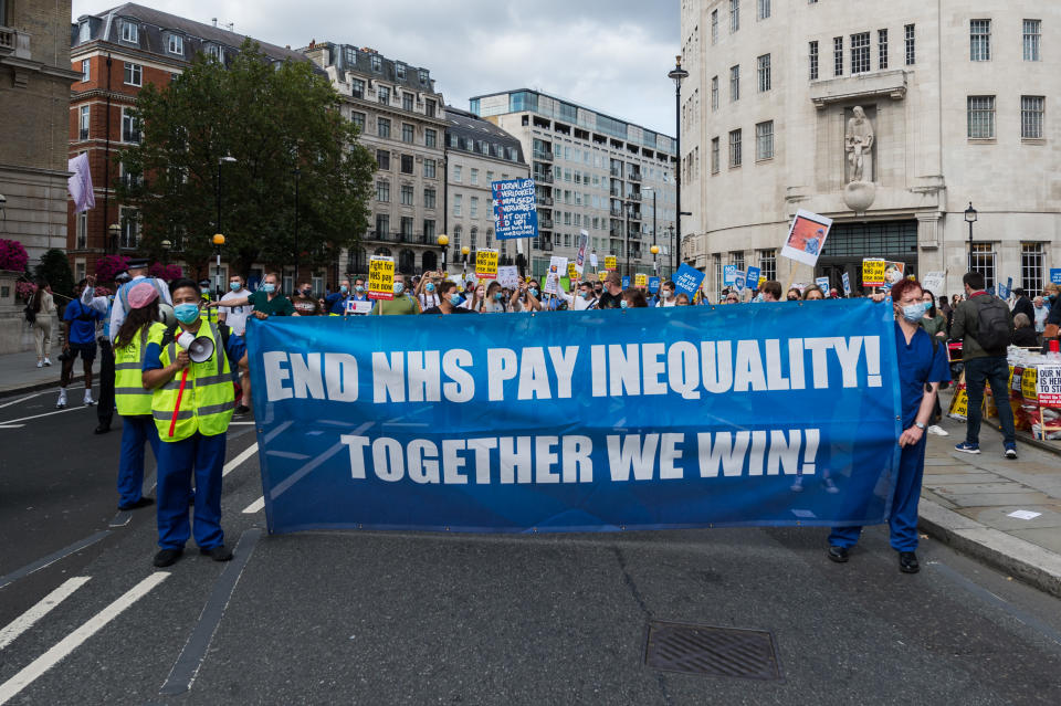 NHS staff march from BBC Broadcasting House to Trafalgar Square through central London in a protest to demand 15% pay rise for NHS workers on 12 September, 2020 in London, England. Protesters demonstrate against not being included in the government's pay deal for 900,000 public sector workers amid the sacrifices and hardship experienced during the coronavirus pandemic. (Photo by WIktor Szymanowicz/NurPhoto via Getty Images)