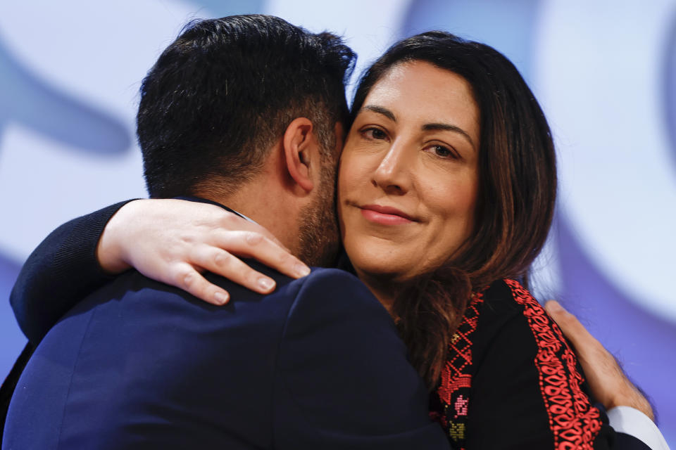Yousaf embraces his wife Councillor Nadia El-Nakla after she spoke in Aberdeen in October 2023. (Getty)