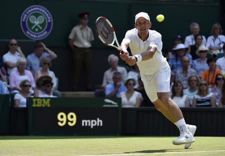 Jarkko Nieminen of Finland hits a shot during his match against Novak Djokovic of Serbia at the Wimbledon Tennis Championships in London, July 1, 2015. REUTERS/Toby Melville