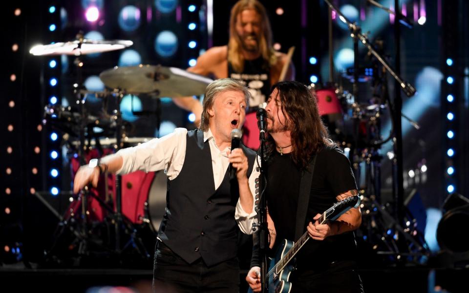 Paul McCartney and Dave Grohl at the 2021 induction ceremony - Reuters