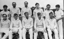 <p>A teenaged Philip (bottom row, centre) donned crisp cricket whites for a team photo at school in Scotland in 1938. Photo: Getty Images.</p> 