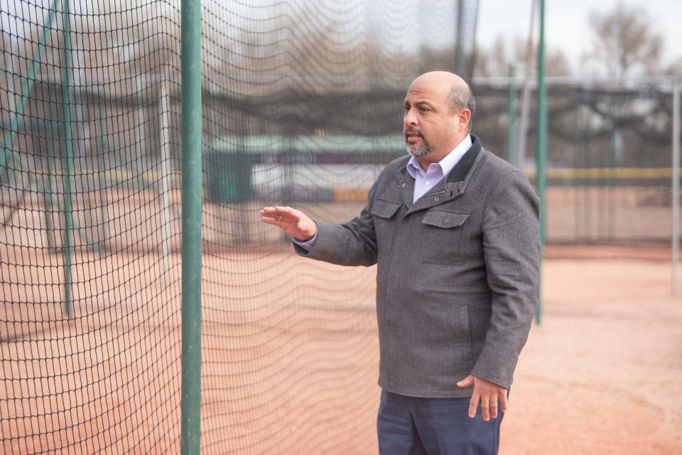 Richard Orona, vice president of the Runyon Field Board of Directors, highlights upgrades of batting cages at Hobbs Field on Tuesday, February 6, 2024.