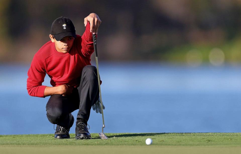 PHOTO: Charlie Woods lines up a putt, Dec. 18, 2022, on the 18th hole during the final round of the PNC Championship at Ritz-Carlton Golf Club in Orlando, Fla. (Mike Ehrmann/Getty Images, FILE)