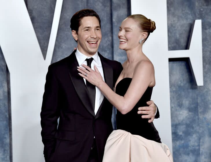 Justin Long, left, and Kate Bosworth arrive at the Vanity Fair Oscar Party on Sunday, March 12, 2023
