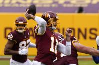 Washington Football Team quarterback Alex Smith throws during the first half of an NFL football game against the Los Angeles Rams Sunday, Oct. 11, 2020, in Landover, Md. (AP Photo/Steve Helber)