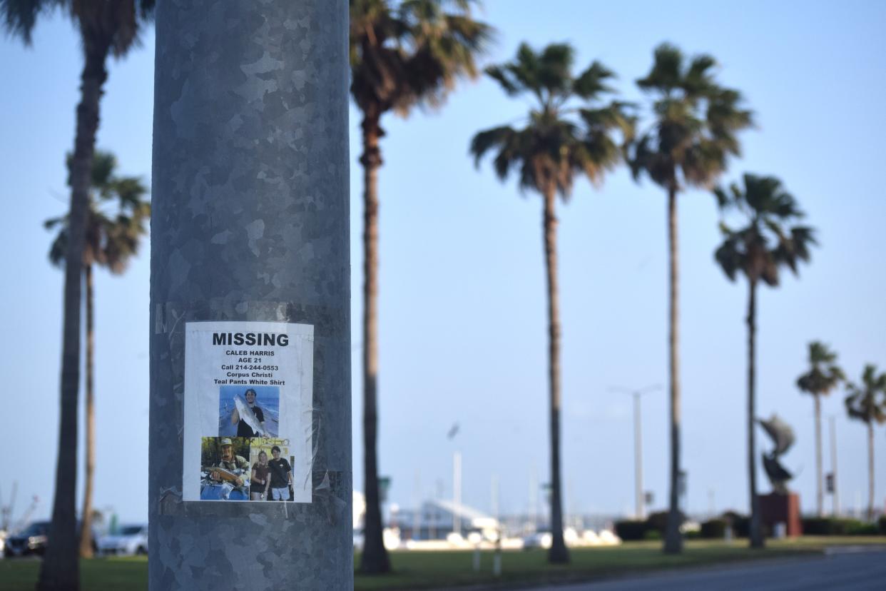 A photo taken April 19 of a poster taped to a column near Ocean Drive depicting missing Texas A&M University-Corpus Christi student Caleb Harris and alerting anyone with information about his whereabouts to call (214) 244-0553.