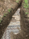 A view of a well-preserved colorful mosaic floor of an ancient Roman villa archaeologists have revealed among vineyards near the northern city of Verona, Italy. The official in charge of archaeology Verona province, Gianni De Zuccato, on Friday, May 29, 2020, said the mosaics appeared to be ‘’in a good state of conservation,’’ from what they are able to observe after gingerly digging a trench between vineyards in the hills of Valpolicella, known for its full-bodied red wine. (Soprintendenza ABAP Verona via AP)