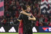 St. Louis City SC defender Tim Parker, right, and goalkeeper Roman Burki celebrate after their victory over Charlotte FC in an MLS soccer match Saturday, March 4, 2023, in St. Louis. (AP Photo/Joe Puetz)