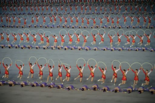 The "Grand Mass Gymnastics and Artistic Performance" features enormous numbers of people -- mostly students and children -- performing synchronised moves