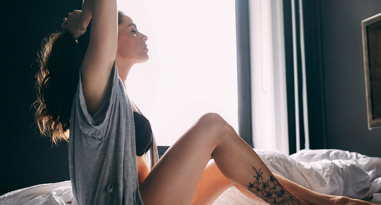 Sexual turn-on: Woman tying up hair. (Getty Images)