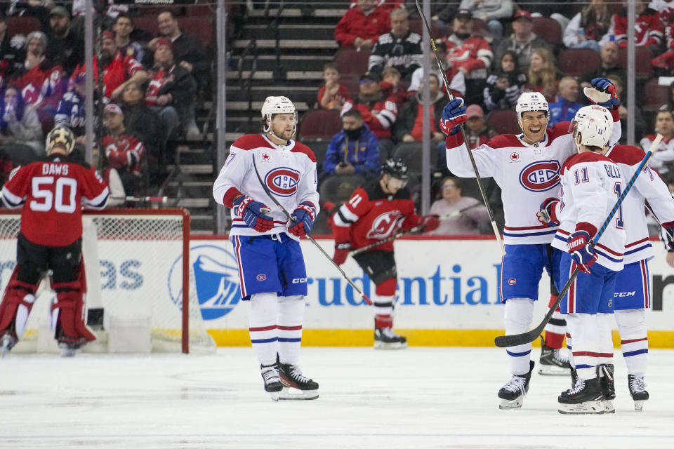 Montreal Canadiens right wing Brendan Gallagher (11) celebrates with his teammates after scoring against the New Jersey Devils during the second period of an NHL hockey game, Saturday, Feb. 24, 2024, in Newark, N.J. (AP Photo/Mary Altaffer)