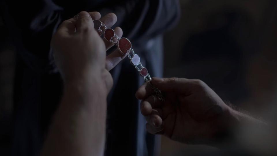 Yennefer holds a bracelet with red jewels on The Witcher