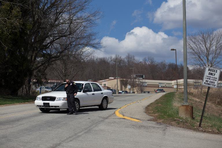 A Murrysville Police officer blocks a road at the scene of a mass stabbing at Franklin Regional Senior High School April 9, 2014 in Murrysville, Pennsylvania