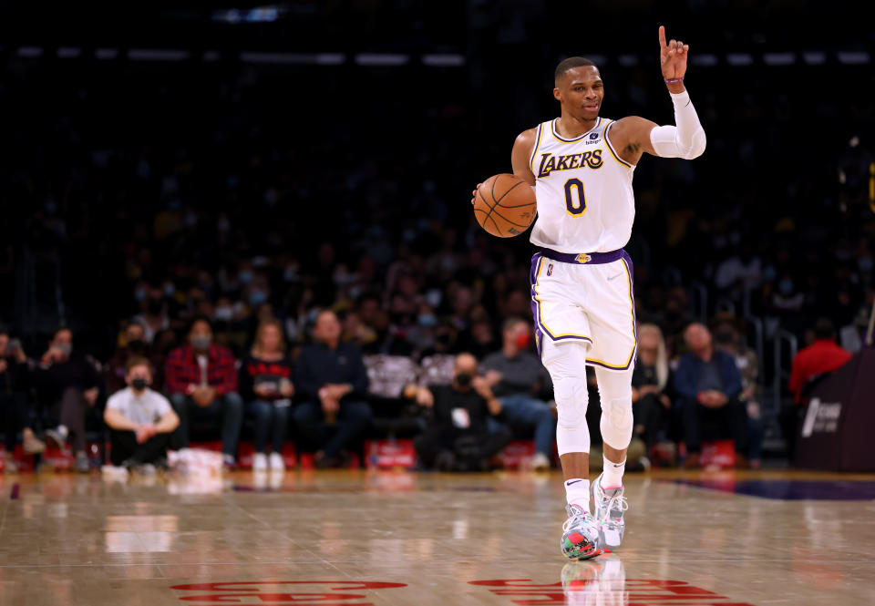 LOS ANGELES, CALIFORNIA - OCTOBER 24: Russell Westbrook #0 of the Los Angeles Lakers signals a play as he brings the ball up court during the first half against the Memphis Grizzlies at Staples Center on October 24, 2021 in Los Angeles, California. (Photo by Harry How/Getty Images)