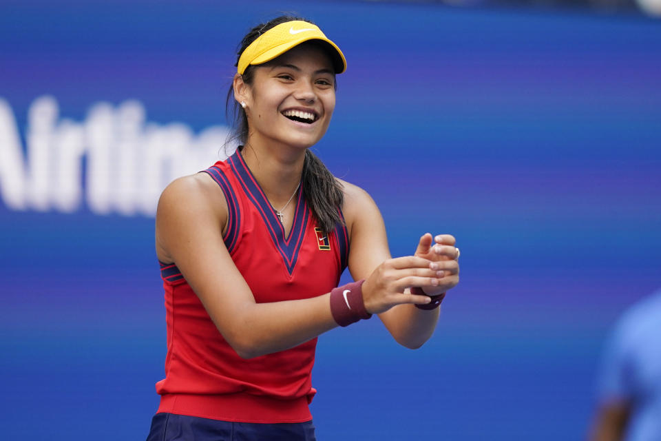 FILE - Emma Raducanu, of Britain, celebrates after winning her match against Shelby Rogers, of the United States, in the fourth round of the US Open tennis championships, Sept. 6, 2021, in New York. Raducanu has been made a Member of the Order of the British Empire (MBE) for services to tennis in the 2021 New Year honours list. (AP Photo/Seth Wenig, file)