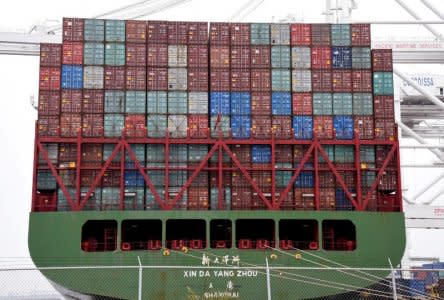 FILE PHOTO:    Shipping containers being loaded onto Xin Da Yang Zhou ship from Shanghai, China at Pier J at the Port of Long Beach in Long Beach, California, U.S., April 4, 2018.  REUTERS/Bob Riha Jr./File Photo