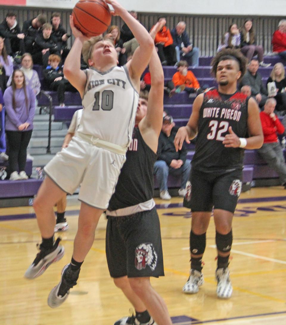 Union City's Wade Hoffman goes up strong for two in the first half versus White Pigeon