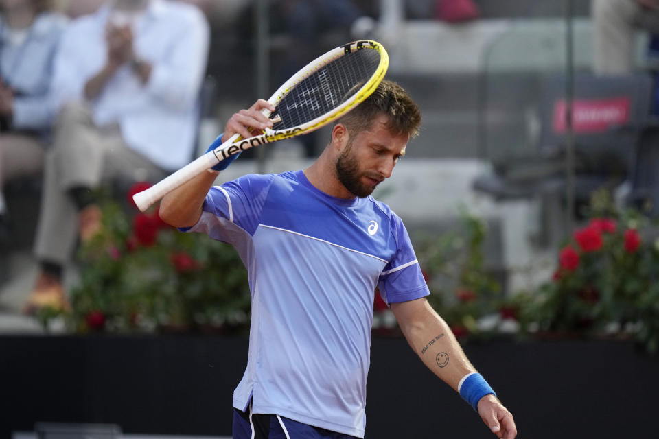 France's Corentin Moutet reacts during a match against Serbia's Novak Djokovic at the Italian Open tennis tournament in Rome, Friday, May 10, 2024. (AP Photo/Alessandra Tarantino)