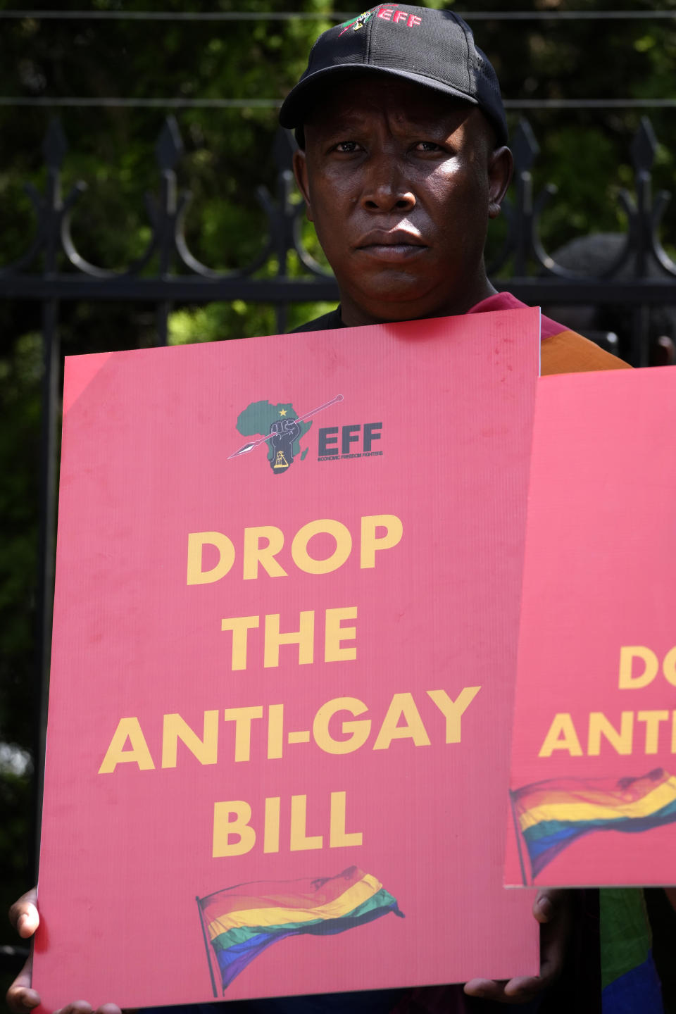 The Economic Freedom Fighters (EFF) leader Julius Malema holds a placard during their picket against Uganda's anti-homosexuality bill at the Ugandan High Commission in Pretoria, South Africa, Tuesday, April 4, 2023. Uganda's legislature last week passed the anti-homosexuality bill. The legislation is now with President Yoweri Museveni, who can sign it into law or return it back to the parliamentary speaker with proposed changes. (AP Photo/Themba Hadebe)