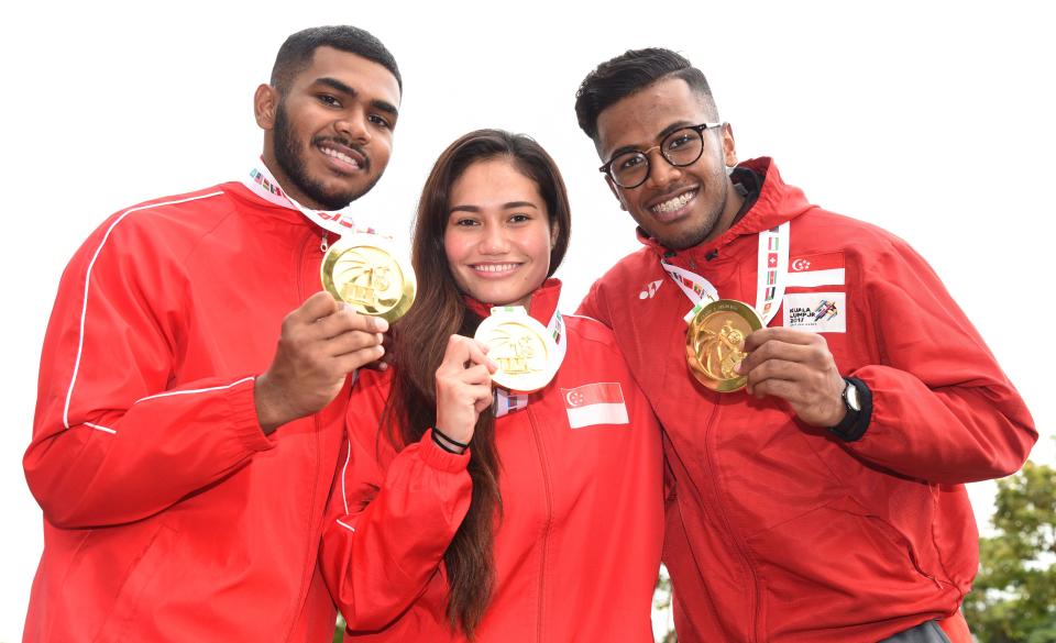 (From left) Sheik Farhan, Nurul Suhaila Mohd Saiful and Sheik Ferdous showing off their gold medals on the final day of 18th World Pencak Silat Championship 2018. (PHOTO: Singapore Silat Federation)