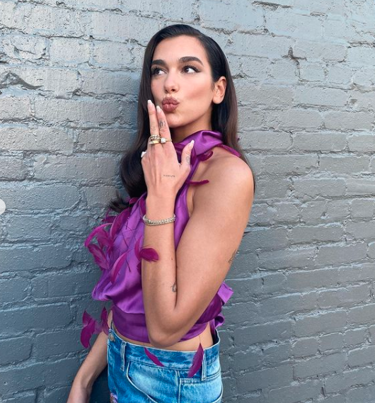 Dua Lipa purple silk top fashion pop star