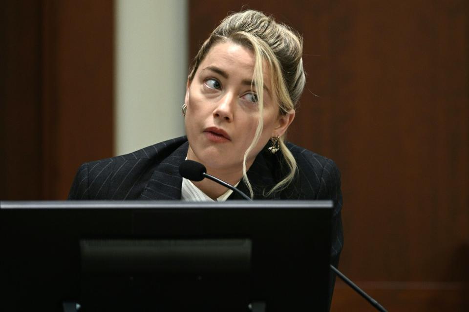 Amber Heard testifies in the courtroom at the Fairfax County Circuit Courthouse