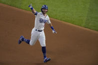 Los Angeles Dodgers' Cody Bellinger celebrates his two-run home run against the Tampa Bay Rays during the fourth inning in Game 1 of the baseball World Series Tuesday, Oct. 20, 2020, in Arlington, Texas. (AP Photo/Sue Ogrocki)