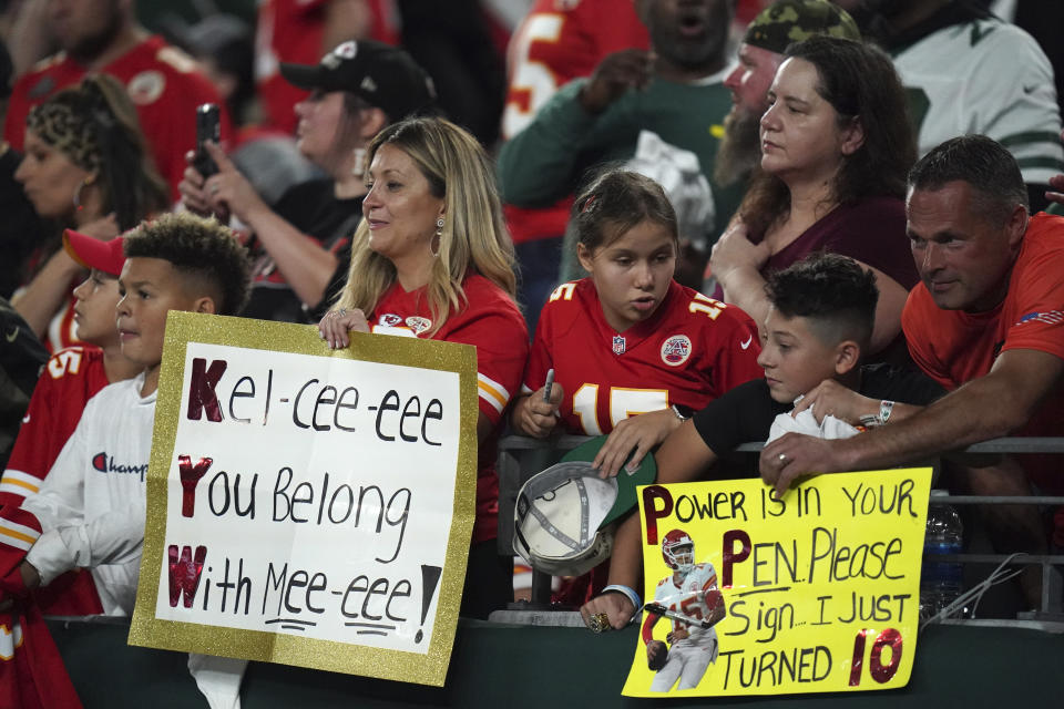 Fans hold signs during an NFL football game between the Kansas City Chiefs and the New York Jets, Sunday, Oct. 1, 2023 in East Rutherford, N.J. Eager as the National Football League has been to cater to the recent public fixation with Taylor Swift and Travis Kelce, it’s certainly not taking any credit for creating the "situationship" between the pop superstar and the Kansas City Chiefs tight end. (AP Photo/Vera Nieuwenhuis)