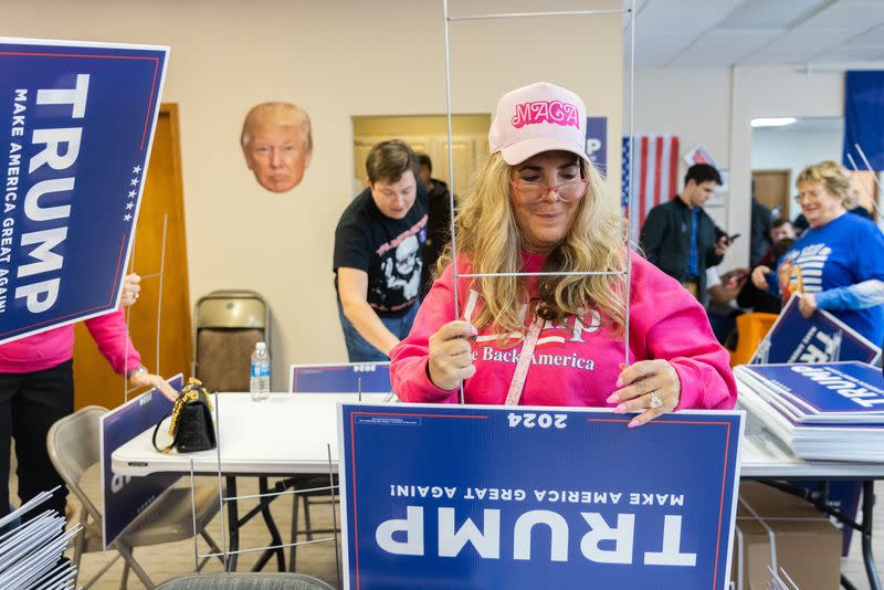 Volunteers work at a former U.S. President's campaign headquarters in Urbandale, Iowa