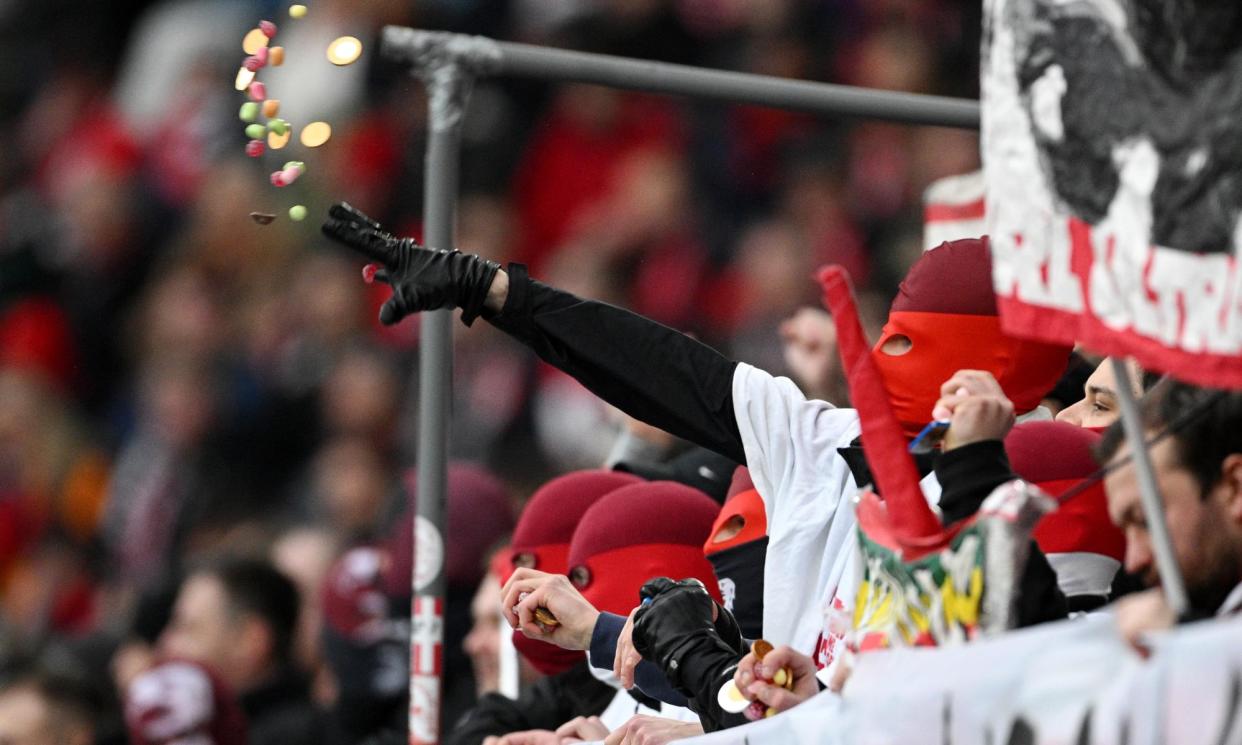 <span>Football fans have hurled chocolate coins on to the pitch at Bundesliga games.</span><span>Photograph: Matthias Hangst/Getty Images</span>