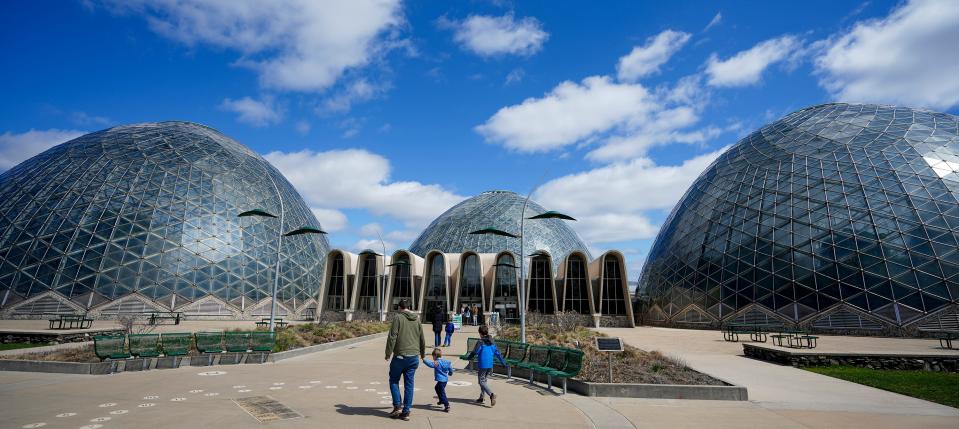 Families enter and exit the Mitchell Park Domes Saturday, April 16, 2022, during the 'Senses' Spring Floral Show located at 524 S. Layton Blvd., Milwaukee.