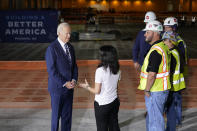 President Joe Biden listens as he tours the building site for a new computer chip plant for Taiwan Semiconductor Manufacturing Company, Tuesday, Dec. 6, 2022, in Phoenix. (AP Photo/Patrick Semansky)